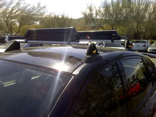 I have used subaru roof rack with the yakima snowboard attachment
